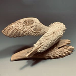 Highly artistic sculpture "Barn Owl" made of mammoth tusk
